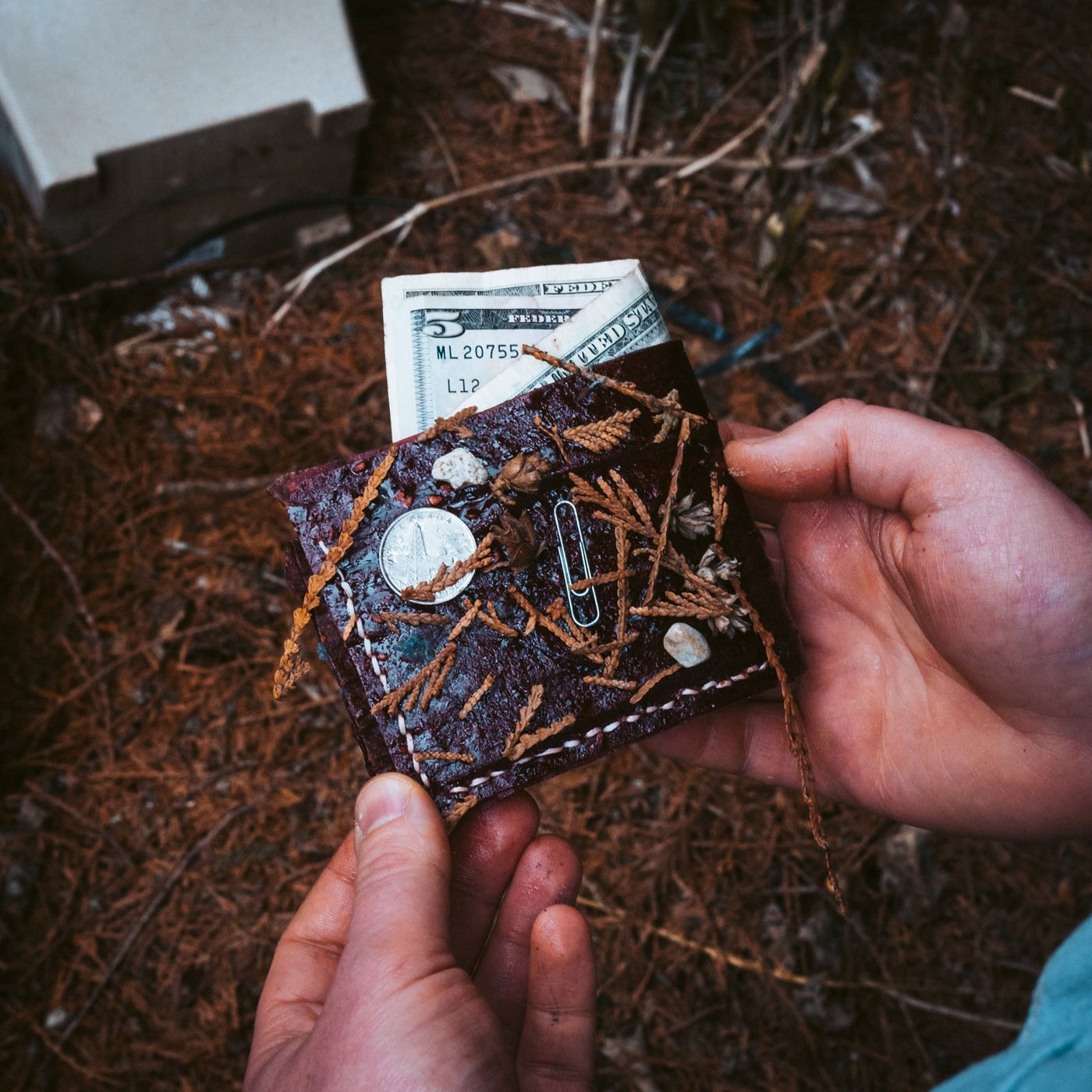 Holding a fruit leather wallet
