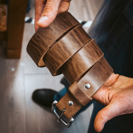 man holding Popov Leather Belt